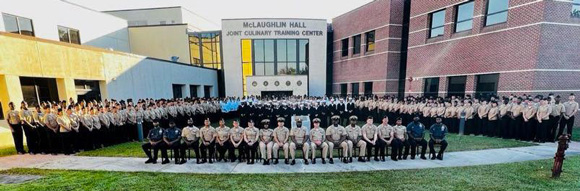 The NTTC Detachment posed outside of McLaughlin Hall.
